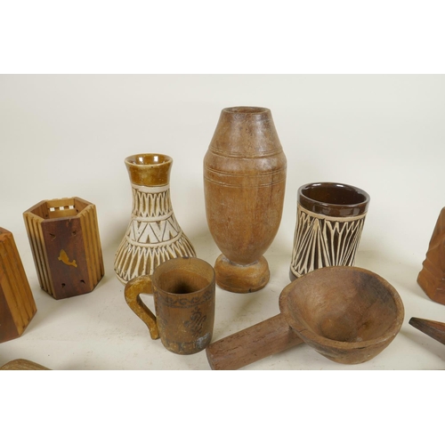 264 - A quantity of various Indo-Persian pottery and treen items to include vases, cups, spice holders, sp... 