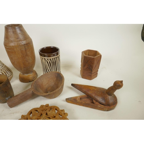 264 - A quantity of various Indo-Persian pottery and treen items to include vases, cups, spice holders, sp... 