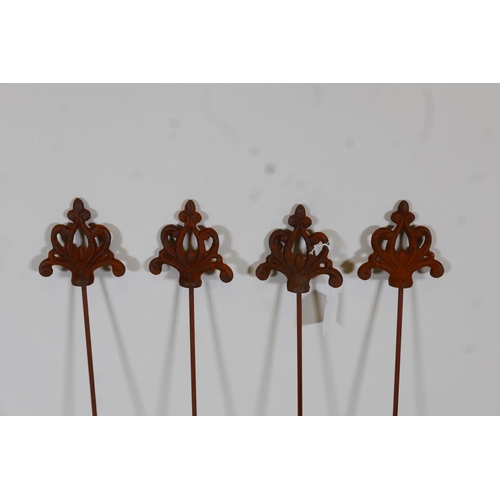 27 - A set of four decorative iron plant stakes, 42½