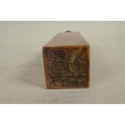 274 - A square section Chinese carved soapstone seal, the top carved as a fo dog, 6