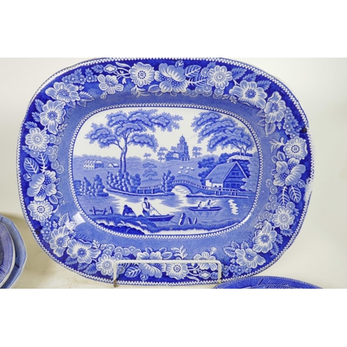 276 - A C19th blue and white meat plate with a boatman on a river, within a wild rose border, possibly Rog... 