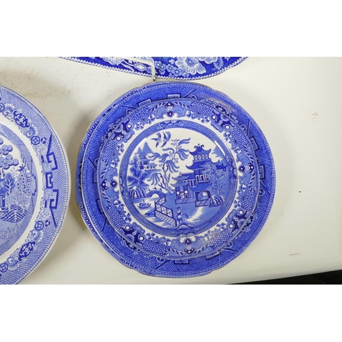 276 - A C19th blue and white meat plate with a boatman on a river, within a wild rose border, possibly Rog... 