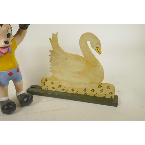 282 - A carved and painted wood figure of a stylised Mickey Mouse, and a painted wood duck plaque, 16