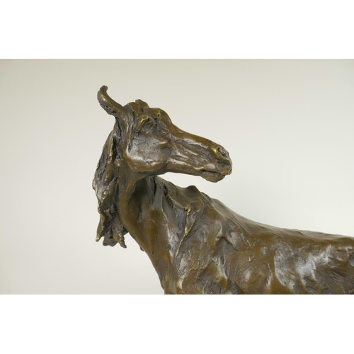 286 - A bronze figure of a horse standing on a rock, signed, 16½