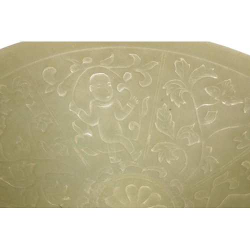 300 - A Chinese celadon porcelain bowl, the interior embossed with figures, 7¼