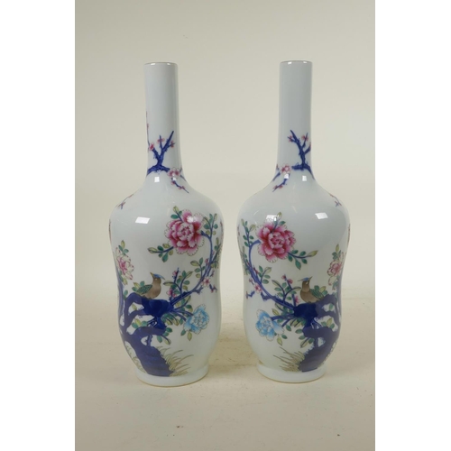 303 - A pair of Chinese blue and white porcelain vases with polychrome enamel decoration depicting Asiatic... 