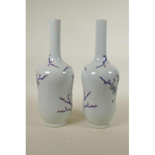 303 - A pair of Chinese blue and white porcelain vases with polychrome enamel decoration depicting Asiatic... 