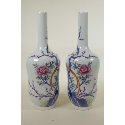 303 - A pair of Chinese blue and white porcelain vases with polychrome enamel decoration depicting Asiatic... 