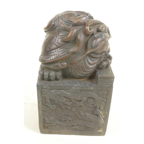 317 - A Chinese bronze seal, the top and sides decorated with dragons, 5