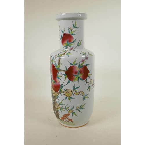 318 - A Chinese polychrome porcelain Rouleau vase with enamelled peach tree decoration, 18