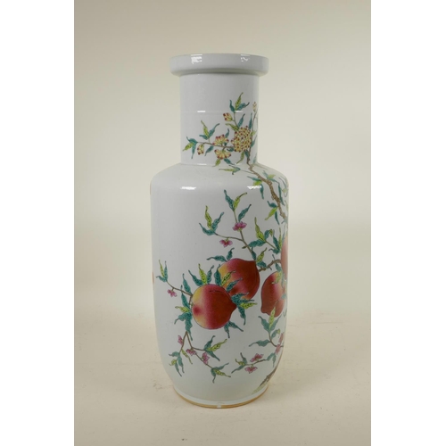 318 - A Chinese polychrome porcelain Rouleau vase with enamelled peach tree decoration, 18