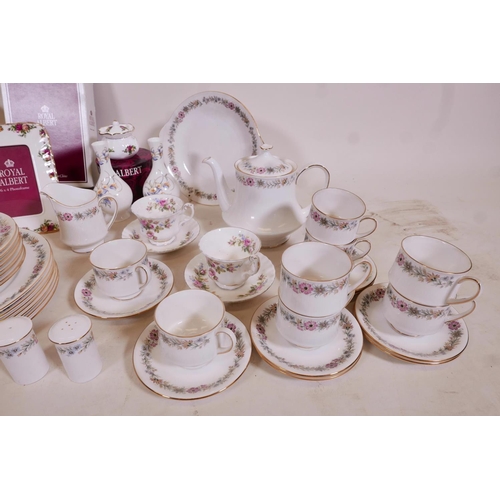 329 - A large quantity of Royal Albert bone china including an 'Old Country Roses' photo frame, 8