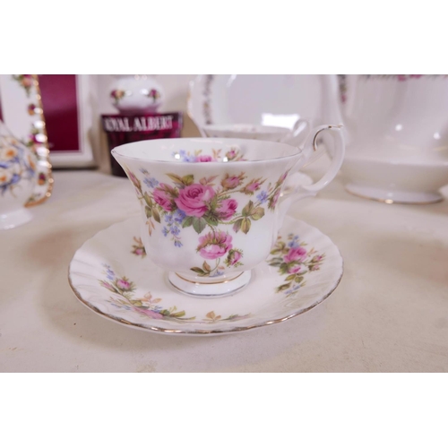 329 - A large quantity of Royal Albert bone china including an 'Old Country Roses' photo frame, 8