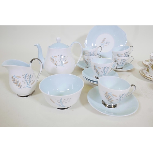 336 - A 1950s Queen Anne fine bone china 'Glade' pattern tea service, in pastel blue and white, with flora... 