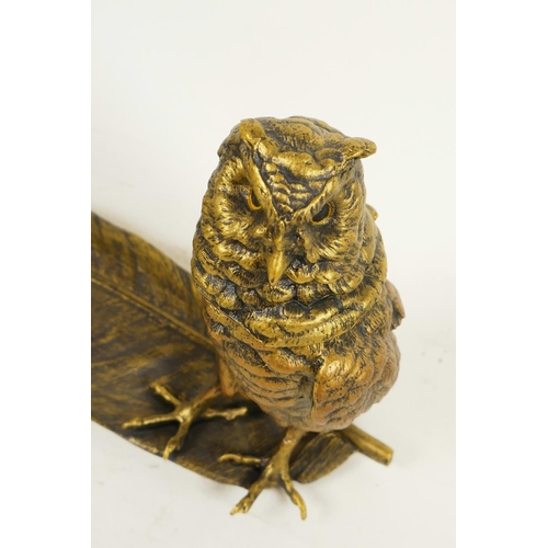 341 - A bronze pen tray and inkwell cast as an owl standing on a large feather, 13½