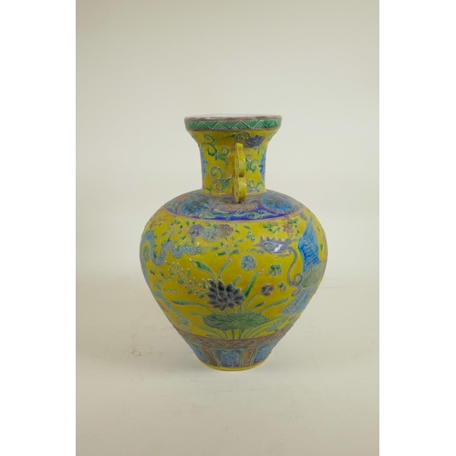 35 - A Chinese Fahua glazed porcelain vase with two handles decorated with a dragon, phoenix and auspicio... 