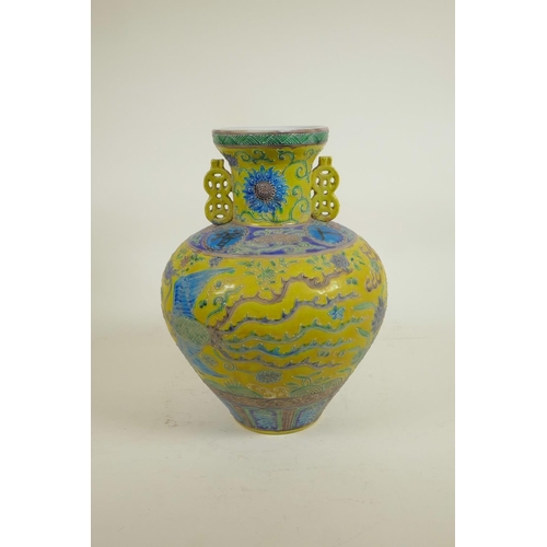 35 - A Chinese Fahua glazed porcelain vase with two handles decorated with a dragon, phoenix and auspicio... 