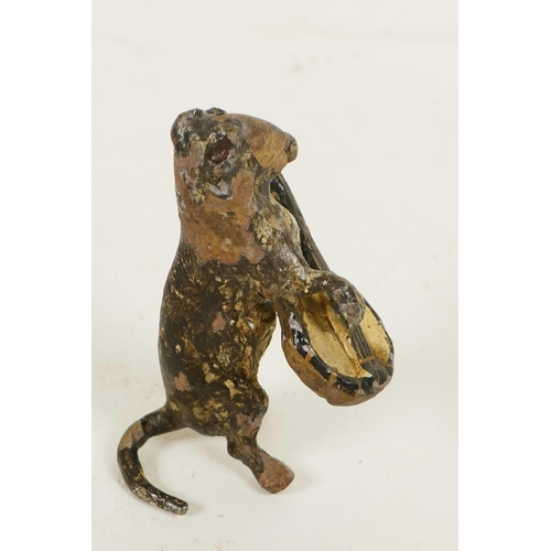 352 - A miniature cold painted bronze figurine of a dog playing a banjo, 1¾