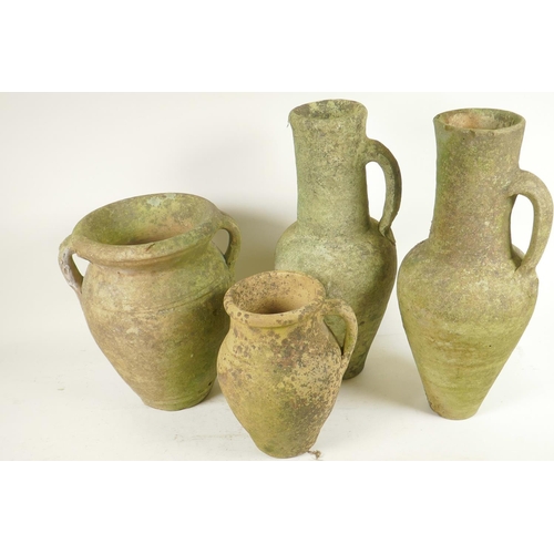 355 - Four terracotta garden ornaments, a pair of Grecian style jugs, 15