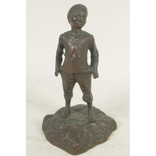 357 - A small bronze figure of a boy, 6½