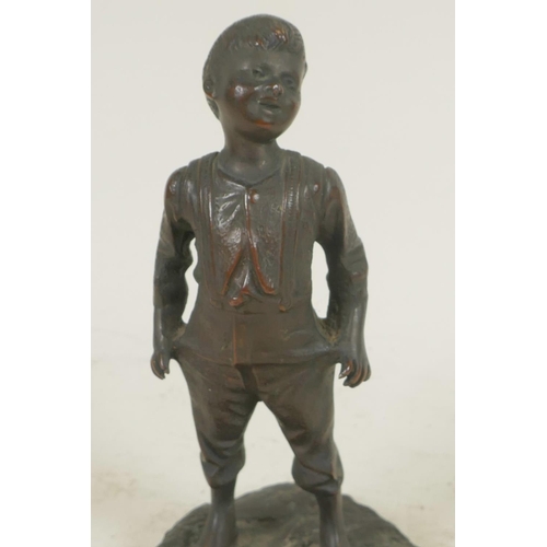 357 - A small bronze figure of a boy, 6½