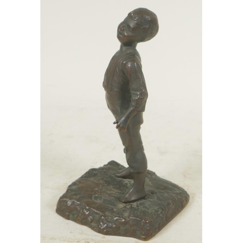 357 - A small bronze figure of a boy, 6½