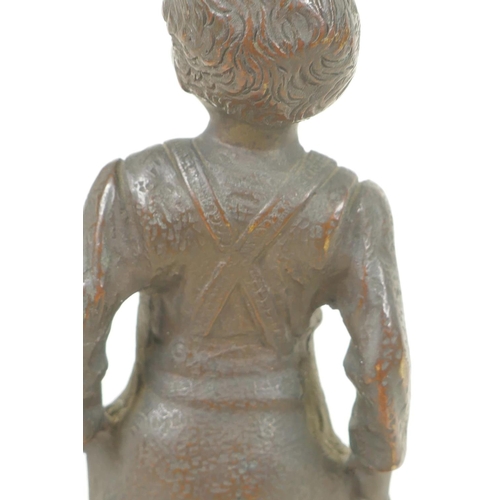 357 - A small bronze figure of a boy, 6½