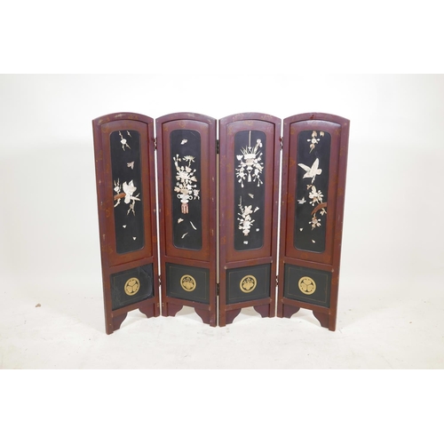 36 - A Japanese lacquer four panel screen with inset bone, mother of pearl and wood decoration depicting ... 