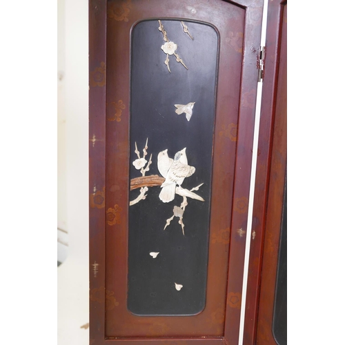 36 - A Japanese lacquer four panel screen with inset bone, mother of pearl and wood decoration depicting ... 