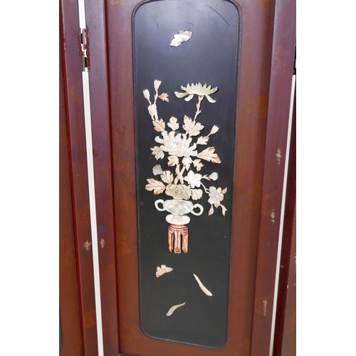 36 - A Japanese lacquer four panel screen with inset bone, mother of pearl and wood decoration depicting ... 