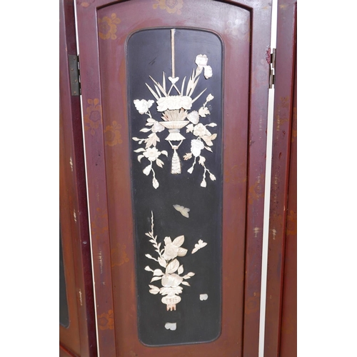 36 - A Japanese lacquer four panel screen with inset bone, mother of pearl and wood decoration depicting ... 