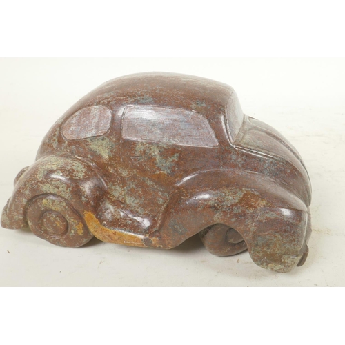 366 - A carved cobalt stone artwork in the form of a Volkswagen Beetle, 7½