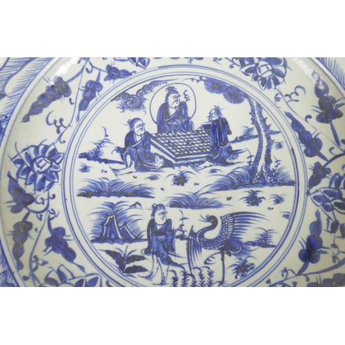 367 - A Chinese blue and white porcelain charger decorated with figures in a garden, 18½