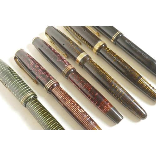 373 - A collection of six Parker 'Vacumatic' fountain pens, US and Canadian made, with 14 gold nibs, large... 