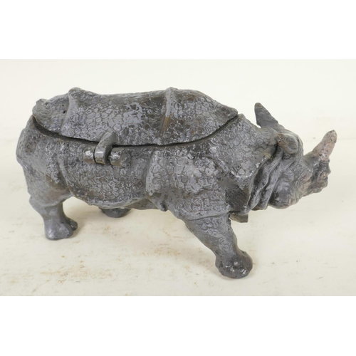 374 - A cold painted cast bronze inkwell in the form of a rhinoceros, 6½