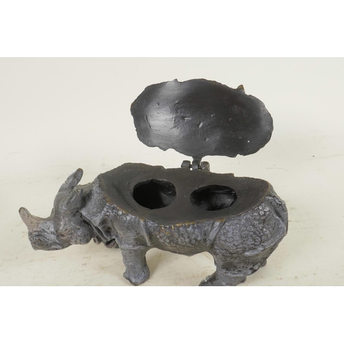 374 - A cold painted cast bronze inkwell in the form of a rhinoceros, 6½