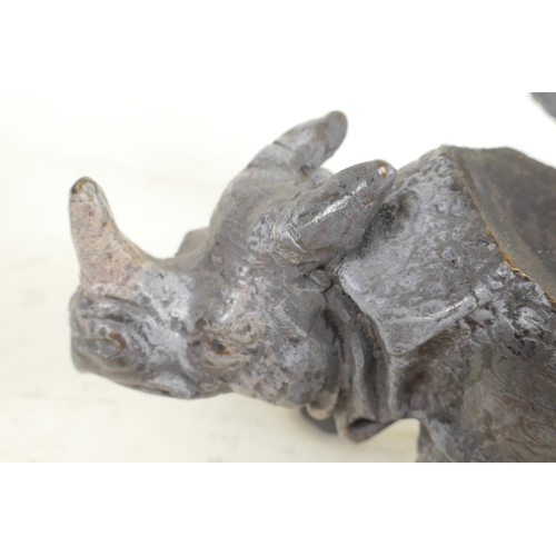 374 - A cold painted cast bronze inkwell in the form of a rhinoceros, 6½