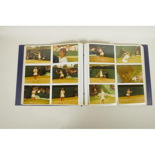 378 - An album of 1970s/80s photographs of professional tennis players, to include a signed photograph of ... 