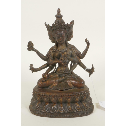 379 - A bronze Buddhistic figure with eight arms, seated upon a lotus throne, pendant 2