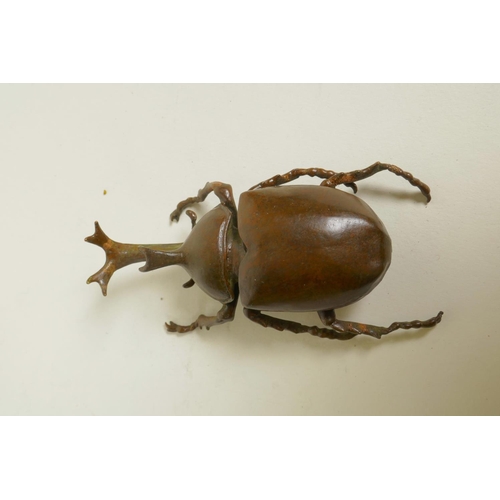 38 - A Japanese Jizai style bronze rhinoceros beetle trinket box, 3½