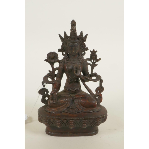 384 - A bronze Buddhistic figure with red patination, 6¼