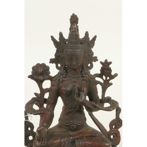 384 - A bronze Buddhistic figure with red patination, 6¼