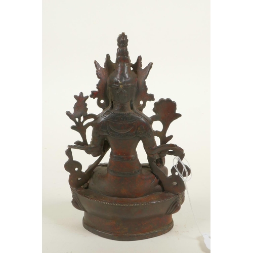 384 - A bronze Buddhistic figure with red patination, 6¼