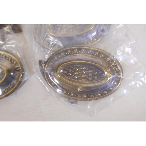 388 - A set of eight Sheraton style brass oval plate handles, 3½