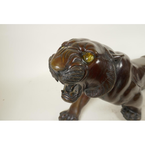 390 - A Japanese bronze figure of a tiger, 25