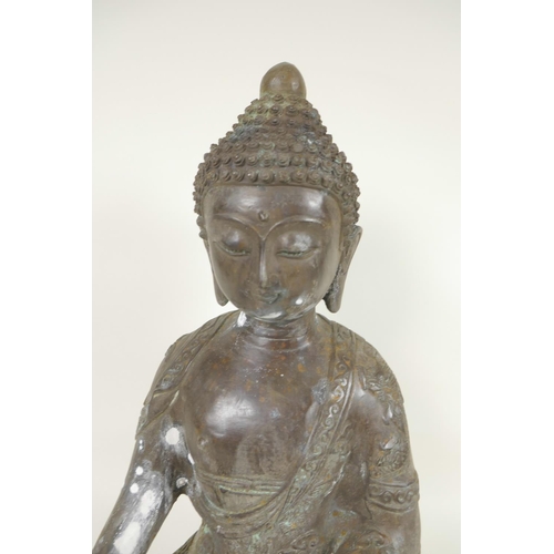 395 - A Chinese cast bronze figure of Buddha seated in the lotus position whilst meditating, cast 6 charac... 