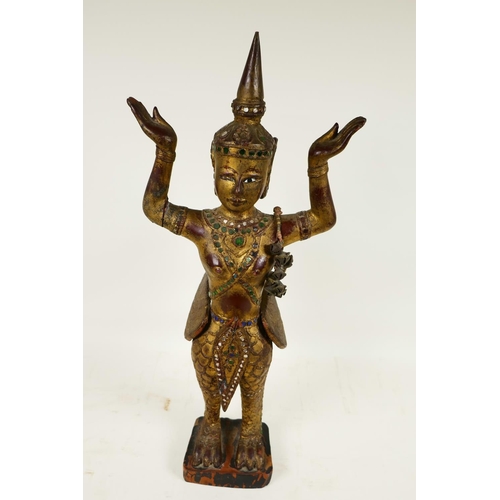 399 - A Thai, carved wood, painted, bejewelled and mirrored figure of a kinnara, 20