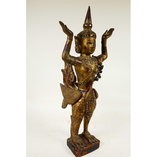 399 - A Thai, carved wood, painted, bejewelled and mirrored figure of a kinnara, 20