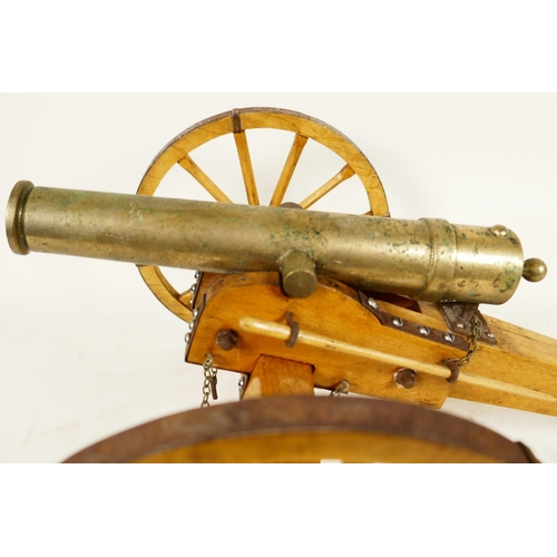 400 - An antique ornamental table top bronze cannon, on a hand made wooden carriage with metal fittings, 1... 