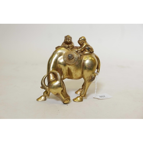 401 - A gilt bronze figure of two boys riding a water buffalo, 6